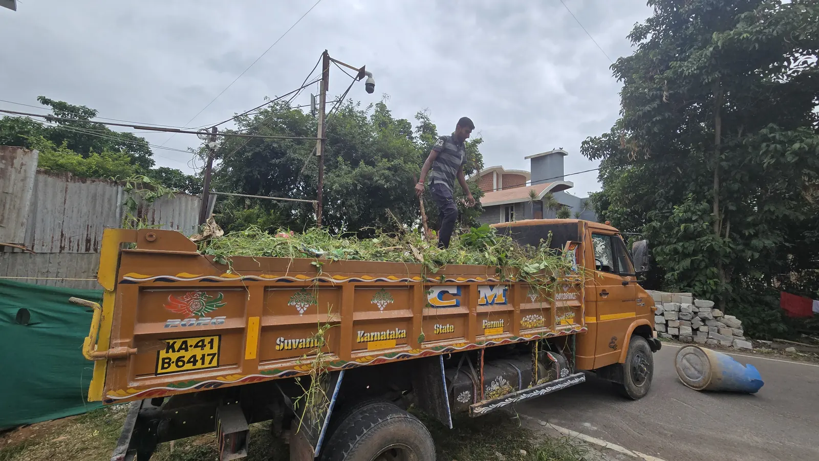 Cleared weeds loaded onto a truck after site cleaning in Bangalore
